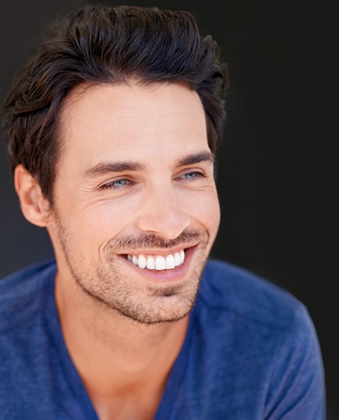Man with bright smile after teeth whitening in Albuquerque