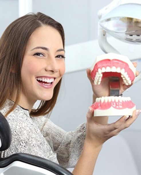 a patient with dentures smiling