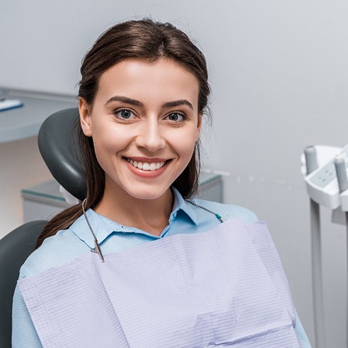 A smiling woman benefiting from tooth-colored fillings in Albuquerque