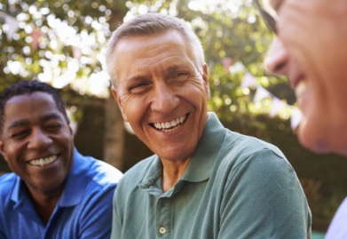 Group of men laughing together outdoors