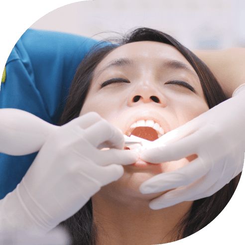 Dental patient receiving scaling and root planing treatment