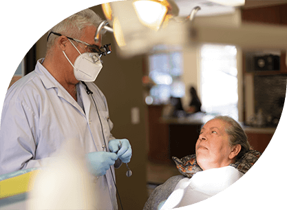 Dentist and dental patient discussing the post operative healing and care process