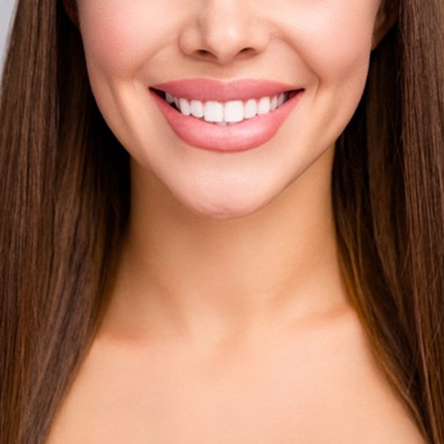 Close-up of woman’s beautiful smile with veneers