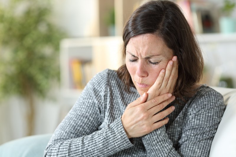 woman experiencing tooth pain   