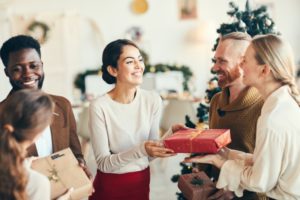 loved ones smiling and celebrating the holidays