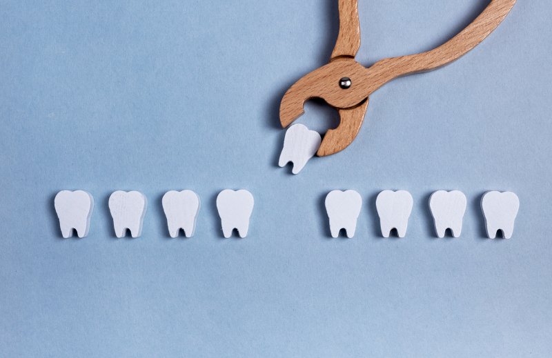 A fun wooden display of a tooth extraction